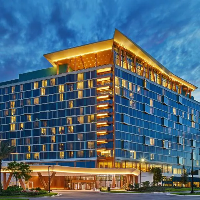 A conference hotel glowing at dusk in Orlando, Florida.